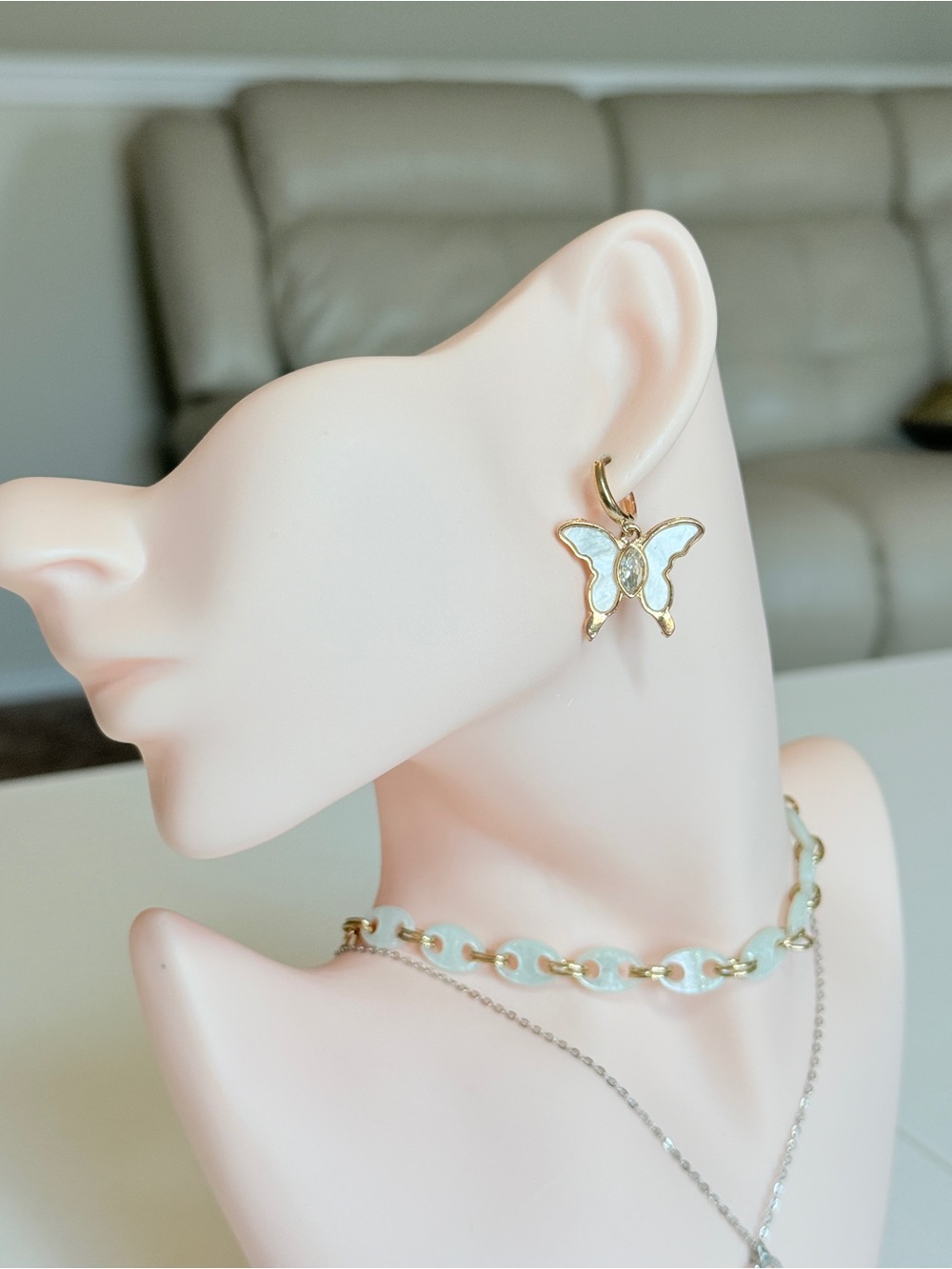 Gold Butterfly Drop Earrings in White Enamel